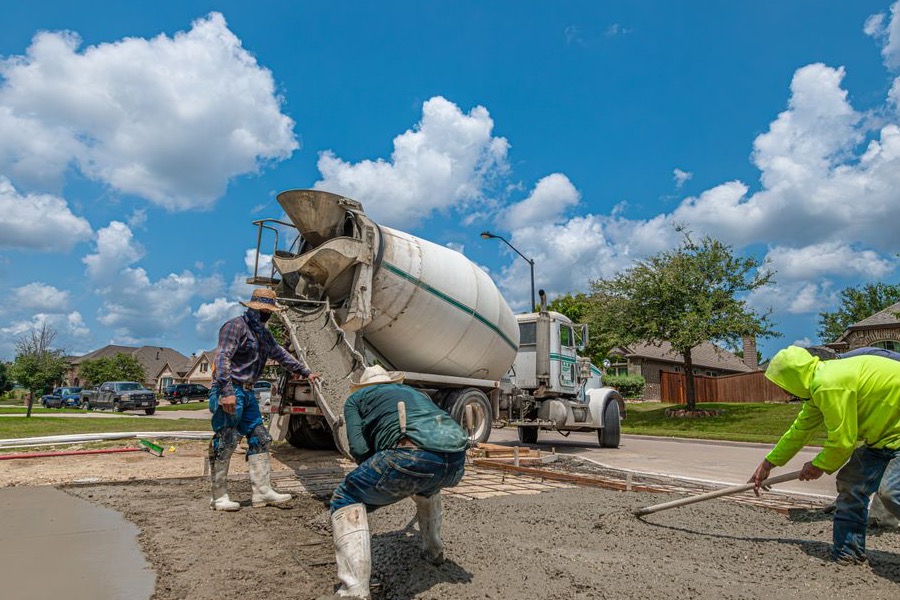 Concreting crew levelling a freshly poured slab on the Central Coast